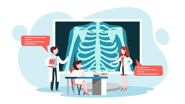doctor standing around a big x-ray image of chest