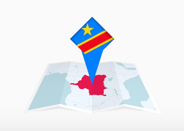 DR Congo is afgebeeld op een gevouwen papieren kaart en een vastgezette locatiemarkering met de vlag van DR Congo.