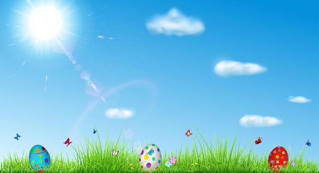 Easter background with sky, sun, grass, easter eggs, butterflies and flowers