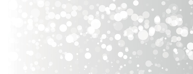 Een bokeh-achtergrond met een zachte witte achtergrond met witte cirkels