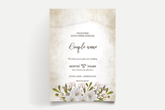 Een huwelijksuitnodiging met witte bloemen erop