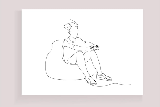 een jongere die op een peervormige bladerdeegbank zit, speelt met zijn hele lichaam met een console in zijn hand