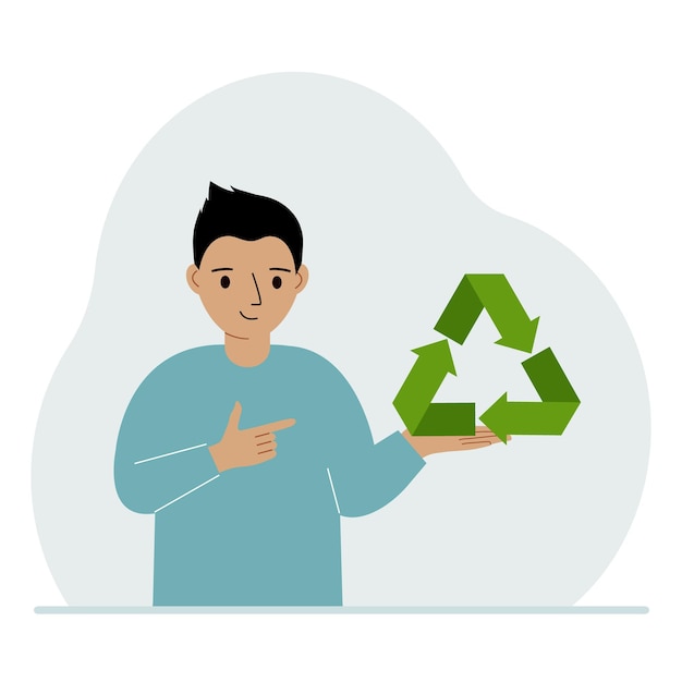 Een kleine jongen houdt een groen recycle recycling- of ecologiebord in zijn handen