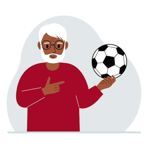 Een man houdt een voetbal in zijn hand Het concept van een spelersfan of coach