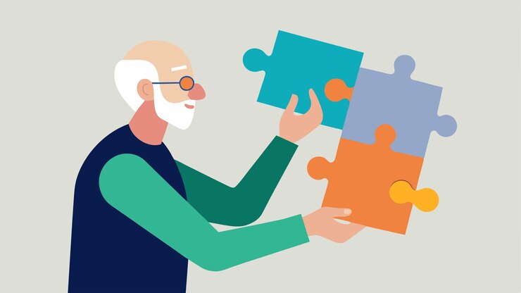 Een oudere man voltooit een puzzel waarbij verschillende stukken in een