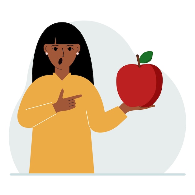 Een vrouw houdt een verse en rode appel in zijn hand Vrouw eet een appel Gezond voedselconcept