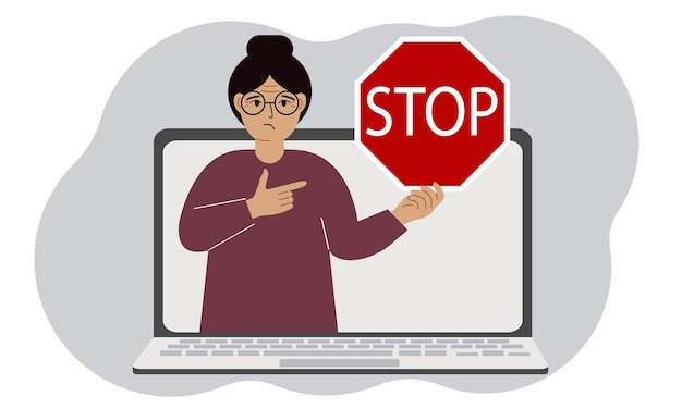 Een vrouw met een rood stopbord op een laptop scherm virus aanval fout account of pagina verwijdering