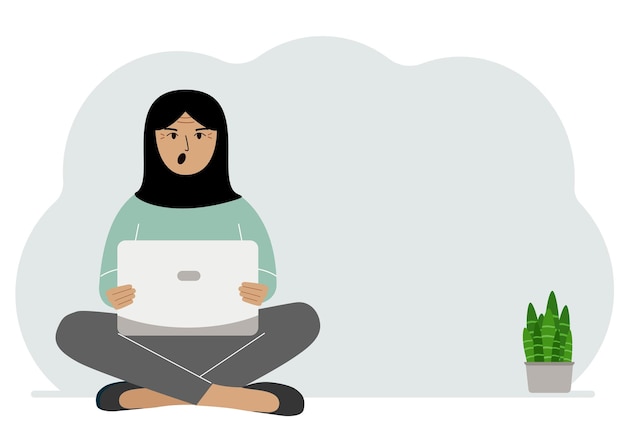 Een vrouw zit met gekruiste benen in zijn handen en houdt een laptop vast Het concept van werkonderwijs, het lezen van video's