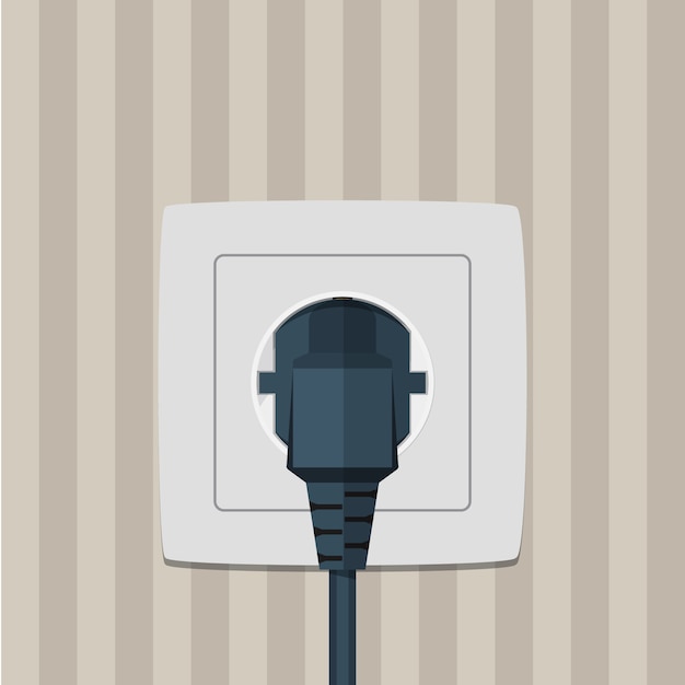 Electric plug and socket on a wall.