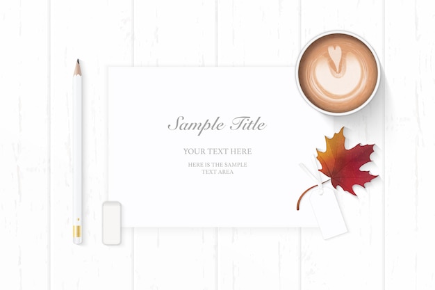 elegant paper with maple leaf and coffee on wooden background