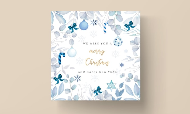 elegant white Christmas card design with leaves and Christmas ornament