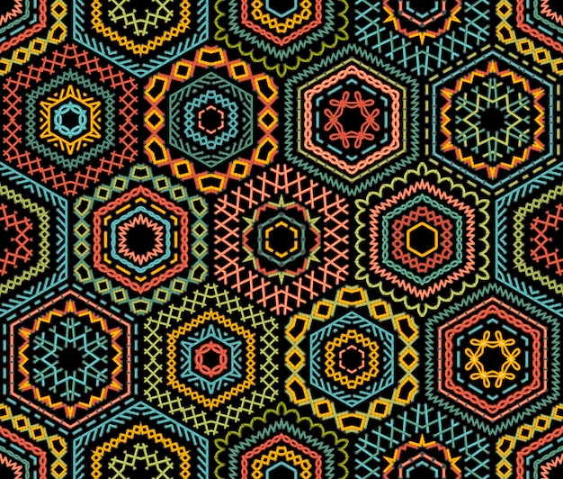 Vector embroidery seamless pattern. high detailed stitches. colourful embroidered hexagons on black background. ethnic textile boundless background.