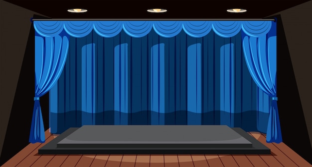 An empty stage with blue curtain