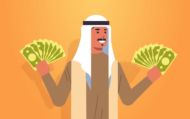 Excited arabic man holding money bills financial success wealth concept rich businessman with dollar banknotes horizontal portrait