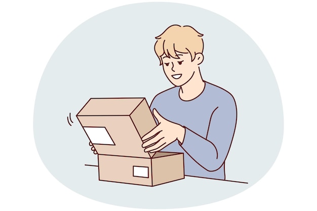 Excited young man open cardboard box shopping online Smiling male client or customer