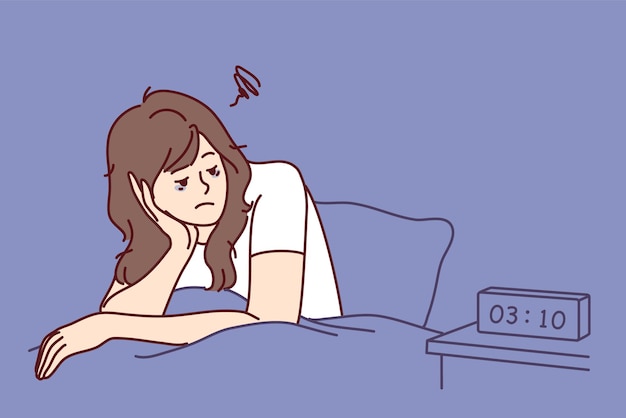 Exhausted woman sit in bed suffer from insomnia