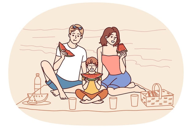 暑い夏の天気で海辺に座ってスイカを食べ晴れたビーチでリラックスする家族