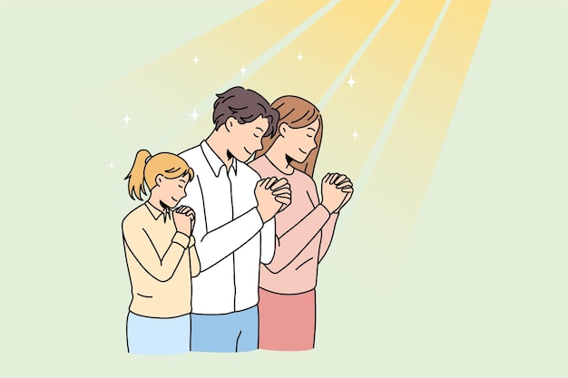Семья с ребенком вместе молиться в церкви