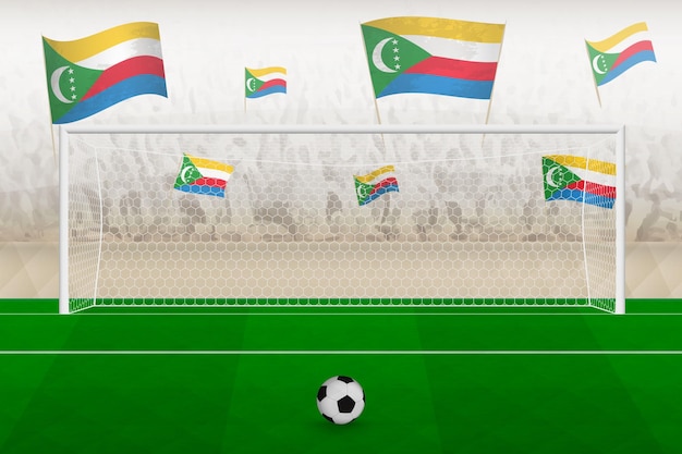 Fans van het voetbalteam van de Comoren met vlaggen van de Comoren juichen het stadionstrafschopconcept toe in een voetbalwedstrijd
