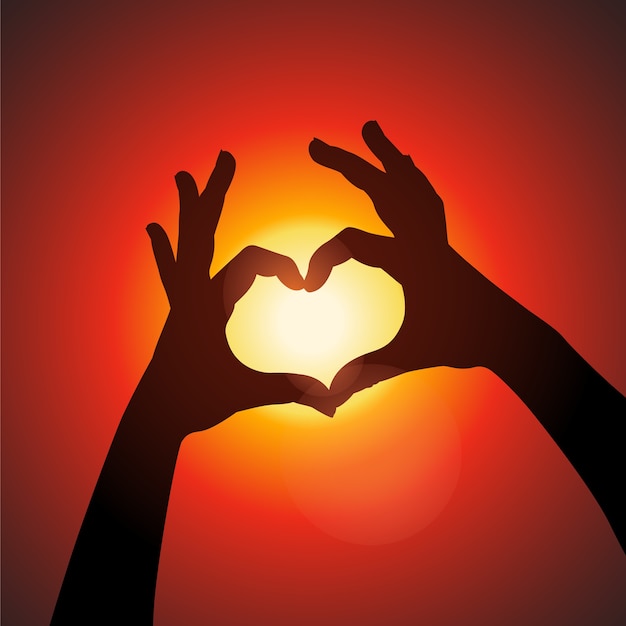 Female hands making sign heart by fingers on sunset background love concept on valentine day