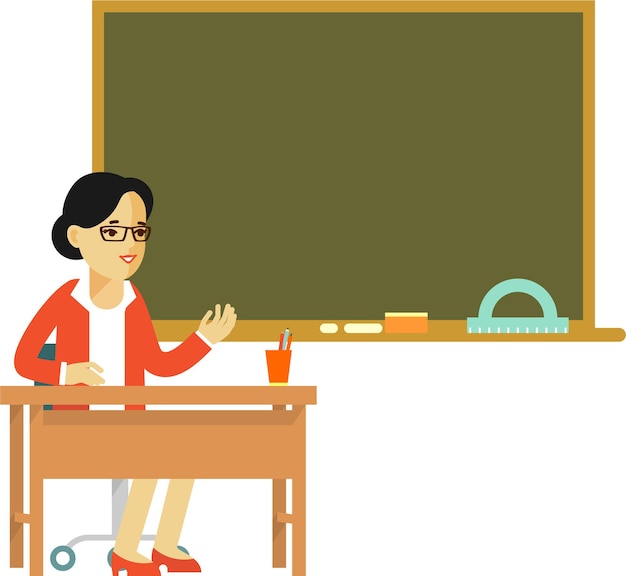 Female School Teacher Siiting at Teacher's Desk Table in Front of Blackboard