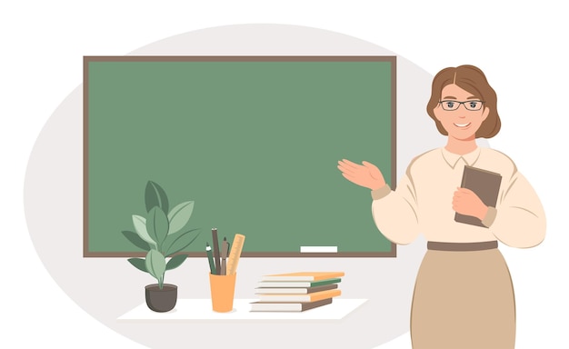 教室の黒板のそばに立っている女性教師
