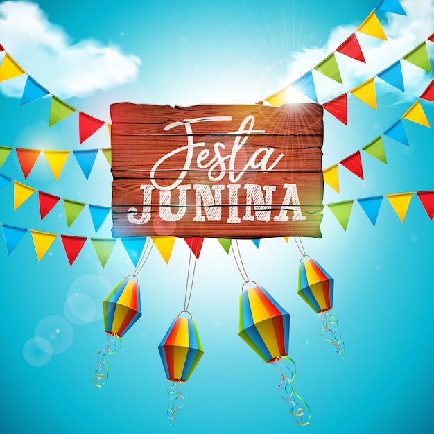 Festa junina met partijvlaggen en papieren lantaarn op blauwe bewolkte hemelachtergrond