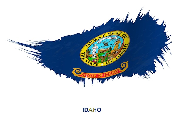 Flag of Idaho state in grunge style with waving effect, vector grunge brush stroke flag.