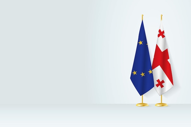 Flags of European Union and Georgia on flag stand meeting between two countries