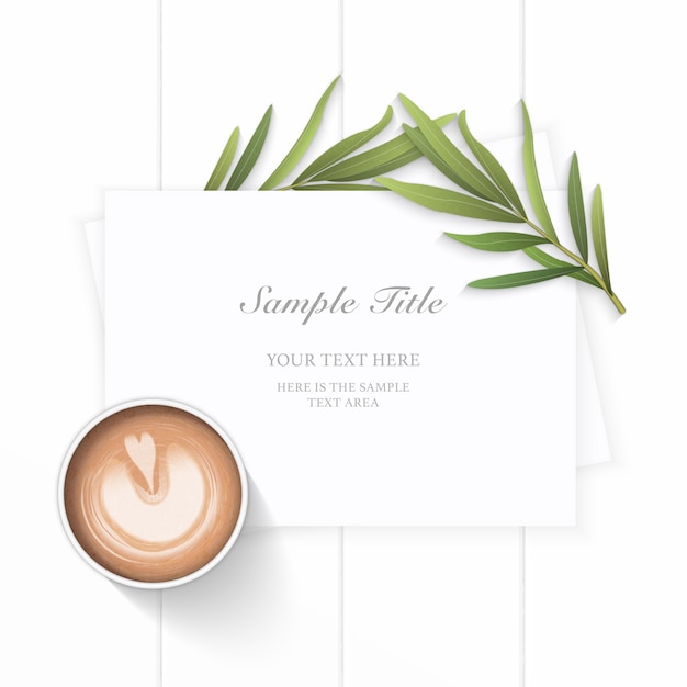 Flat lay top view elegant white christmas composition paper tarragon leaf and coffee on wooden background.