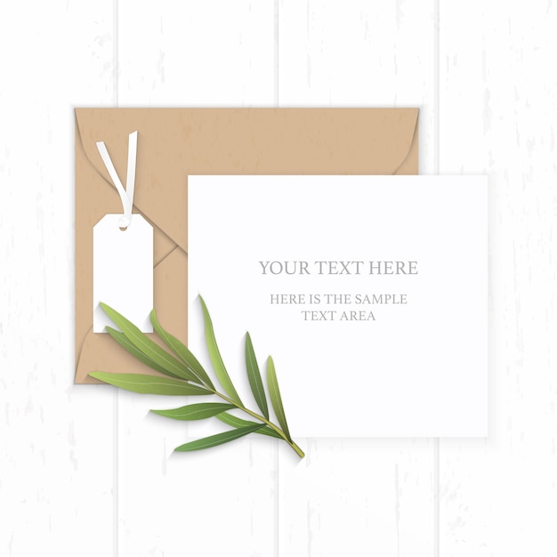 Flat lay top view elegant white composition paper brown kraft envelope tag and tarragon leaf on wooden background.