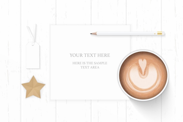 Flat lay top view elegant white composition paper pencil eraser star shape craft tag and coffee on wooden background.