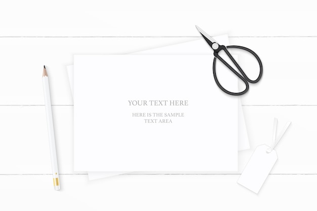 Vector flat lay top view elegant white composition paper pencil tag and vintage metal scissors on wooden background.