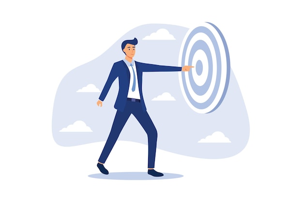 Focus on business target businessman holding archer target or dashboard pointing at bullseye