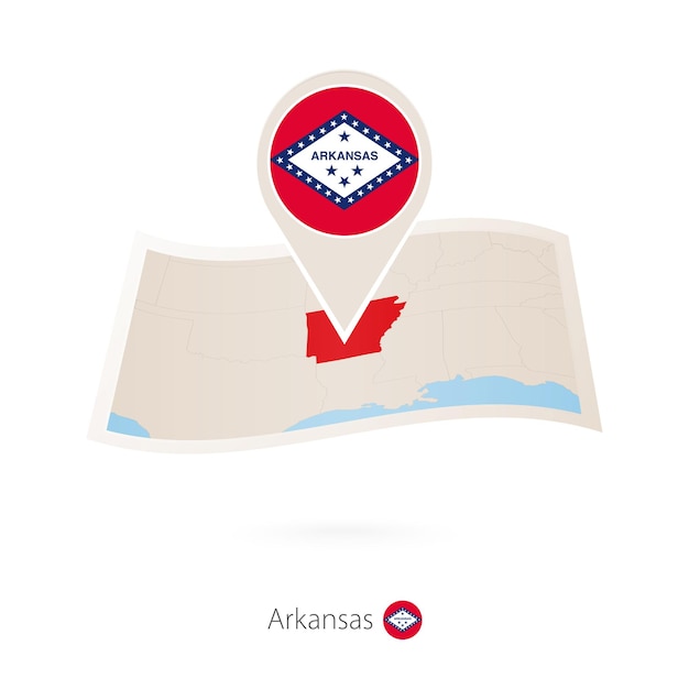 Folded paper map of Arkansas US State with flag pin of Arkansas