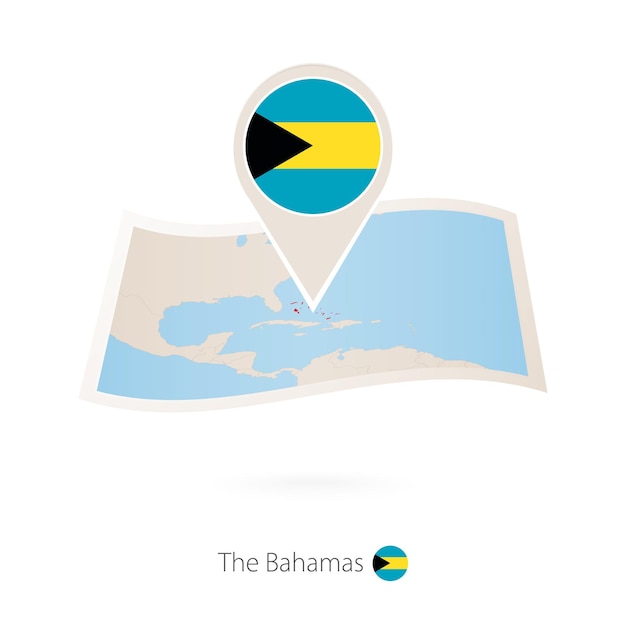 Folded paper map of The Bahamas with flag pin of Bahamas