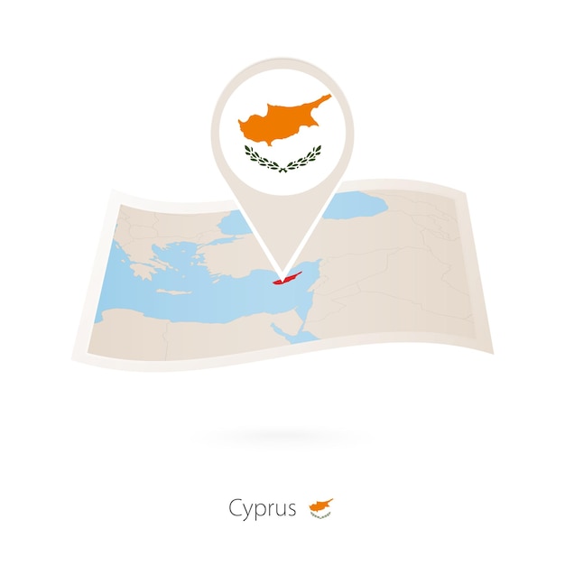 Folded paper map of Cyprus with flag pin of Cyprus