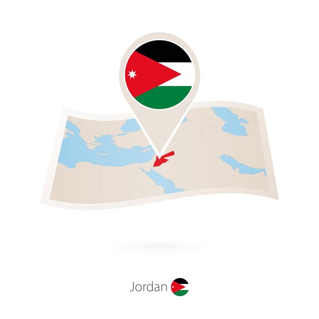 Folded paper map of Jordan with flag pin of Jordan