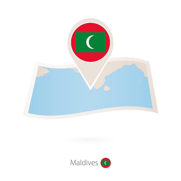 Folded paper map of Maldives with flag pin of Maldives