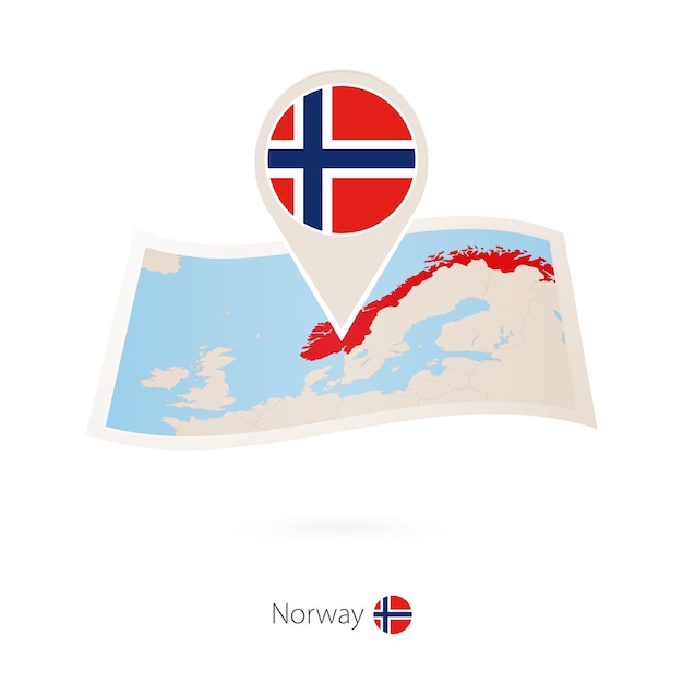 Folded paper map of Norway with flag pin of Norway