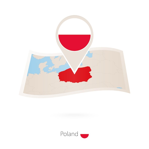 Folded paper map of Poland with flag pin of Poland