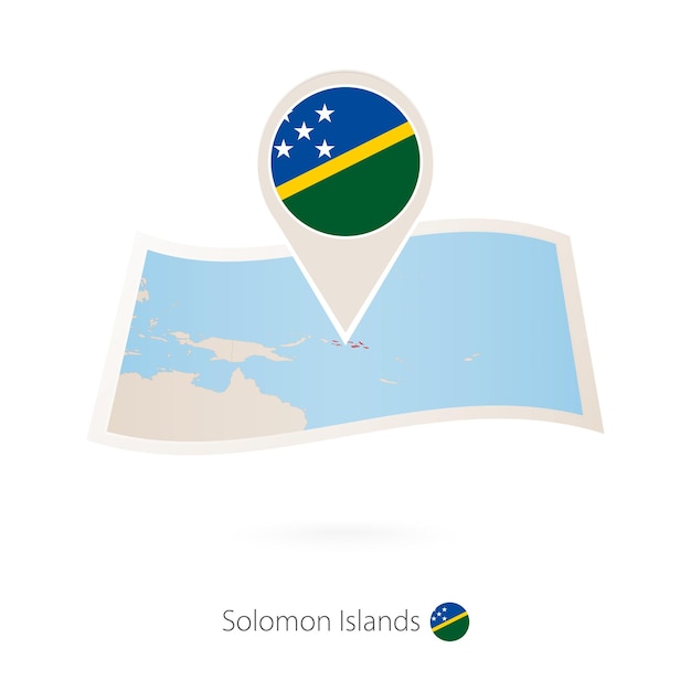 Folded paper map of Solomon Islands with flag pin of Solomon Islands