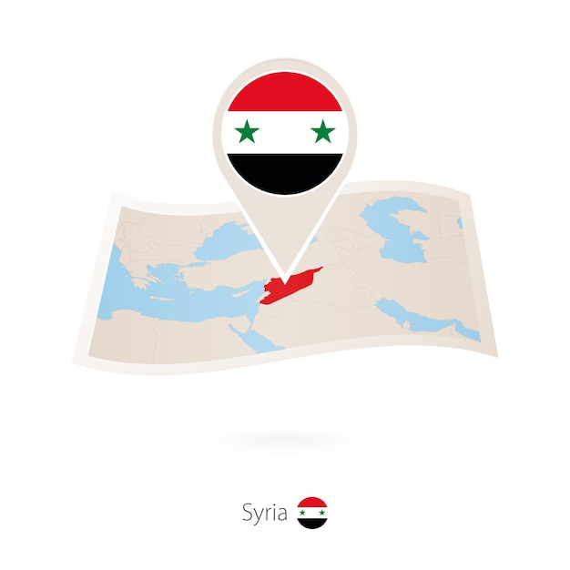 Folded paper map of Syria with flag pin of Syria