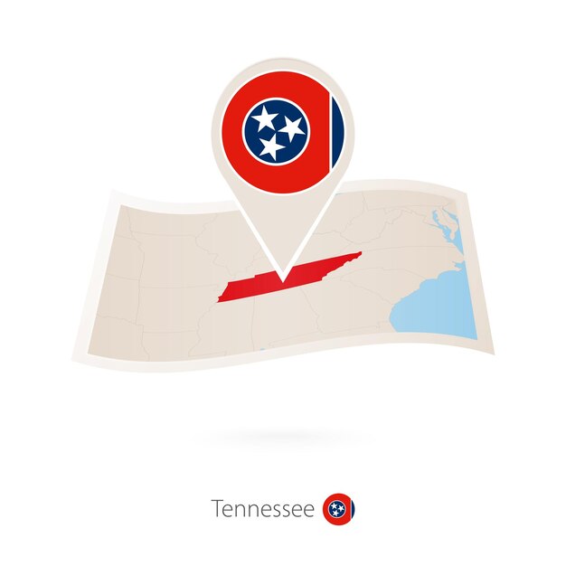 Folded paper map of Tennessee US State with flag pin of Tennessee