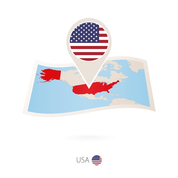 Folded paper map of USA with flag pin of United States of America