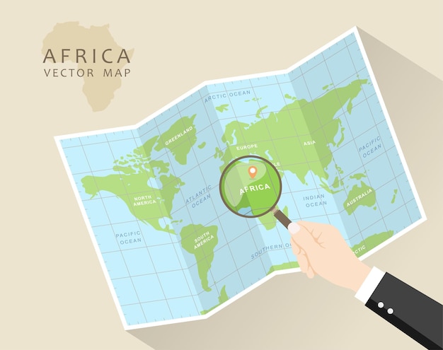 Folded World Map with Magnifying Glass Africa in Focus