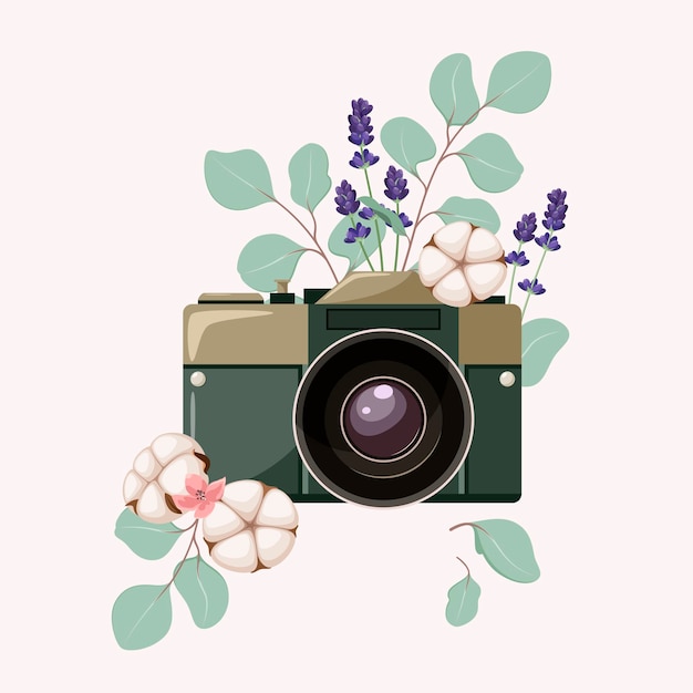 Fotocamera met katoenen bloemen en takjes.