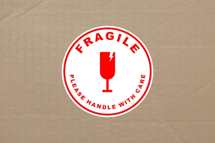 Vector fragile handle with care sticker and poster for delivery service