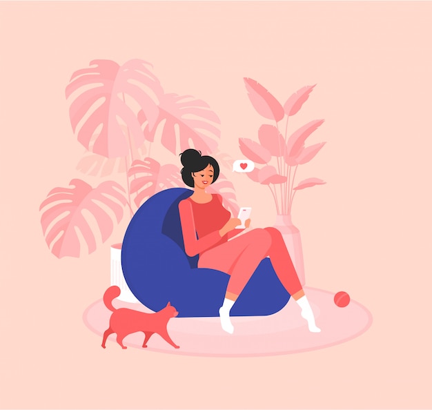 Freelancer girl is sitting in an armchair