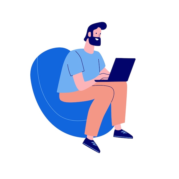 A freelancer man works at a laptop while sitting in a chair